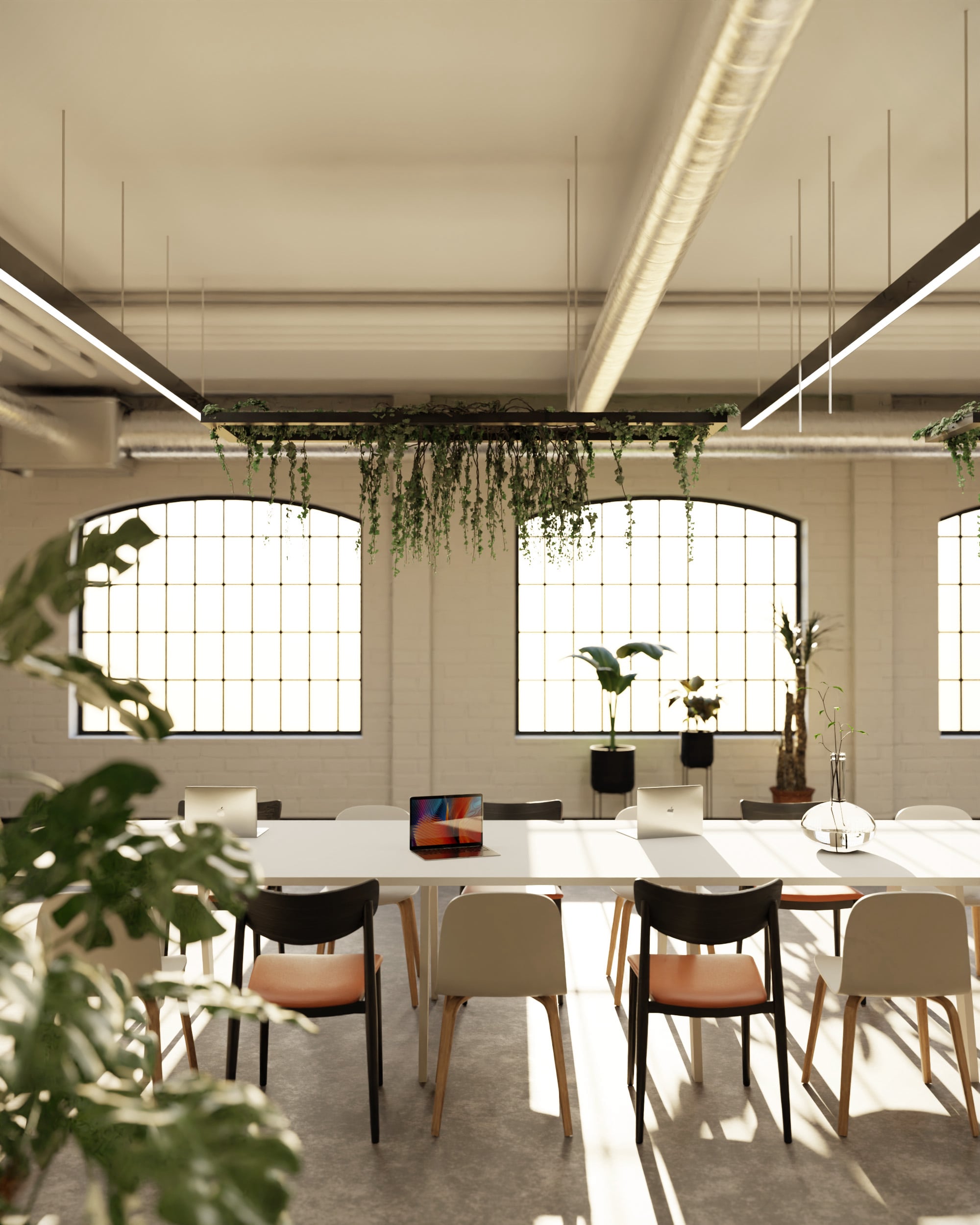 Modern office visual in an industrial-style meeting space with exposed ducts and natural light – Close Shot